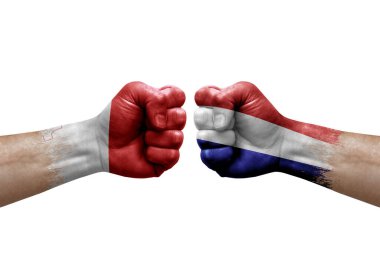 Two hands punch to each others on white background. Country flags painted fists, conflict crisis concept between malta and netherlands