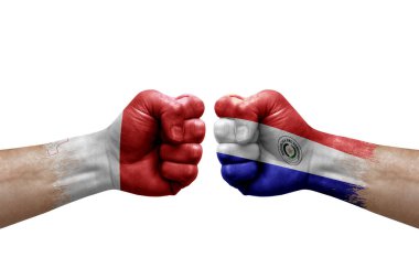 Two hands punch to each others on white background. Country flags painted fists, conflict crisis concept between malta and paraguay