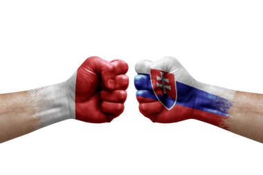 Two hands punch to each others on white background. Country flags painted fists, conflict crisis concept between malta and slovakia