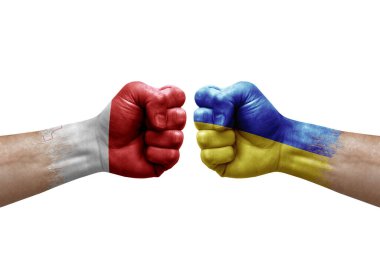 Two hands punch to each others on white background. Country flags painted fists, conflict crisis concept between malta and ukraine