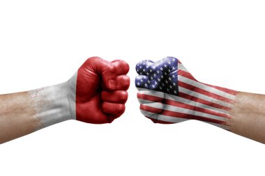 Two hands punch to each others on white background. Country flags painted fists, conflict crisis concept between malta and usa