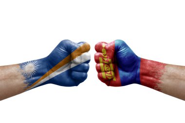 Two hands punch to each others on white background. Country flags painted fists, conflict crisis concept between marshall islands and mongolia