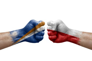 Two hands punch to each others on white background. Country flags painted fists, conflict crisis concept between marshall islands and poland