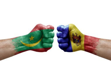 Two hands punch to each others on white background. Country flags painted fists, conflict crisis concept between mauritania and moldova