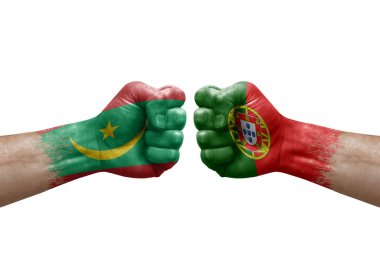 Two hands punch to each others on white background. Country flags painted fists, conflict crisis concept between mauritania and portugal