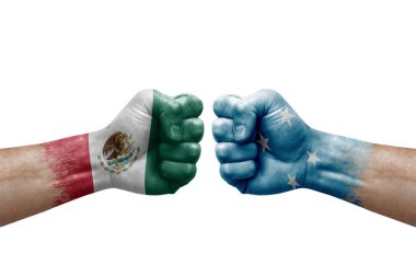 Two hands punch to each others on white background. Country flags painted fists, conflict crisis concept between mexico and micronesia