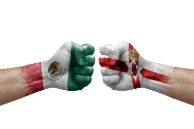 Two hands punch to each others on white background. Country flags painted fists, conflict crisis concept between mexico and ireland
