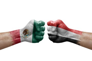 Two hands punch to each others on white background. Country flags painted fists, conflict crisis concept between mexico and yemen