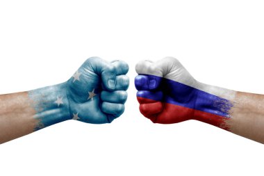 Two hands punch to each others on white background. Country flags painted fists, conflict crisis concept between micronesia and russia