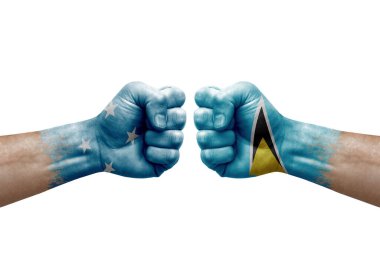 Two hands punch to each others on white background. Country flags painted fists, conflict crisis concept between micronesia and saint lucia