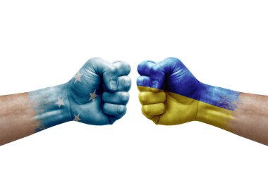 Two hands punch to each others on white background. Country flags painted fists, conflict crisis concept between micronesia and ukraine