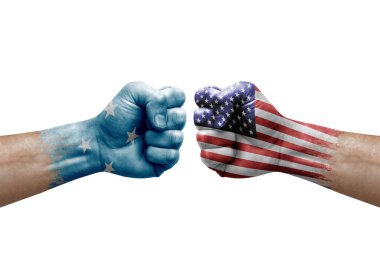 Two hands punch to each others on white background. Country flags painted fists, conflict crisis concept between micronesia and usa
