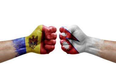 Two hands punch to each others on white background. Country flags painted fists, conflict crisis concept between moldova and nepal