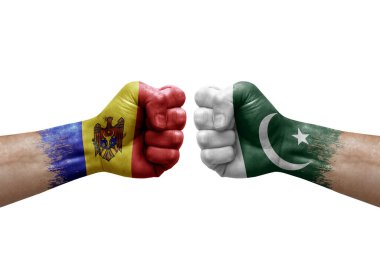 Two hands punch to each others on white background. Country flags painted fists, conflict crisis concept between moldova and pakistan