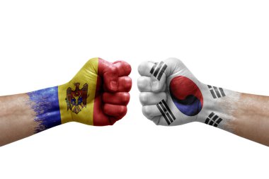 Two hands punch to each others on white background. Country flags painted fists, conflict crisis concept between moldova and south korea