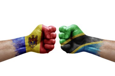 Two hands punch to each others on white background. Country flags painted fists, conflict crisis concept between moldova and tanzania