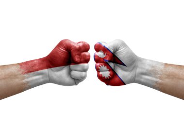Two hands punch to each others on white background. Country flags painted fists, conflict crisis concept between monaco and nepal