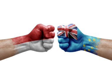 Two hands punch to each others on white background. Country flags painted fists, conflict crisis concept between monaco and tuvalu
