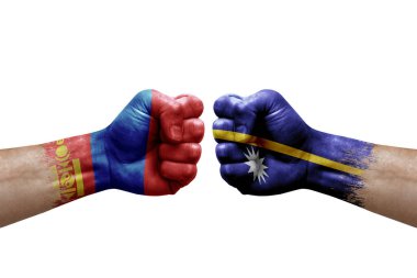 Two hands punch to each others on white background. Country flags painted fists, conflict crisis concept between mongolia and nauru