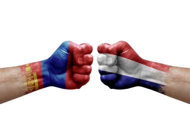 Two hands punch to each others on white background. Country flags painted fists, conflict crisis concept between mongolia and netherlands
