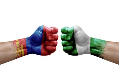 Two hands punch to each others on white background. Country flags painted fists, conflict crisis concept between mongolia and nigeria