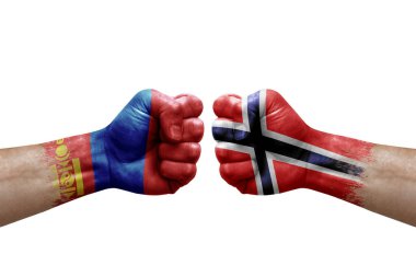 Two hands punch to each others on white background. Country flags painted fists, conflict crisis concept between mongolia and norway