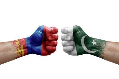 Two hands punch to each others on white background. Country flags painted fists, conflict crisis concept between mongolia and pakistan