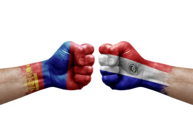Two hands punch to each others on white background. Country flags painted fists, conflict crisis concept between mongolia and paraguay