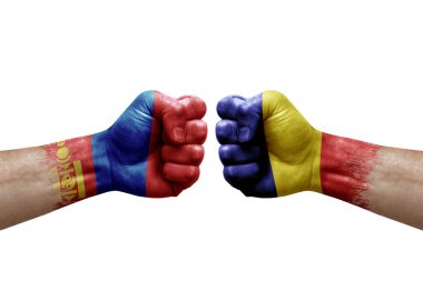 Two hands punch to each others on white background. Country flags painted fists, conflict crisis concept between mongolia and romania