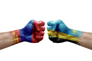 Two hands punch to each others on white background. Country flags painted fists, conflict crisis concept between mongolia and rwanda