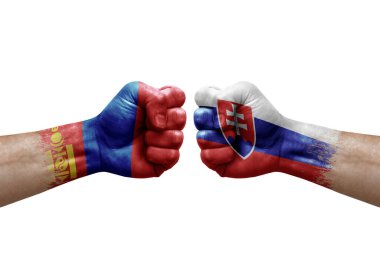 Two hands punch to each others on white background. Country flags painted fists, conflict crisis concept between mongolia and slovakia