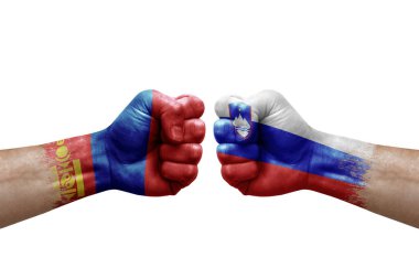 Two hands punch to each others on white background. Country flags painted fists, conflict crisis concept between mongolia and slovenia