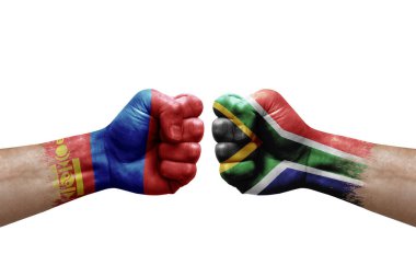 Two hands punch to each others on white background. Country flags painted fists, conflict crisis concept between mongolia and south africa