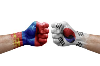 Two hands punch to each others on white background. Country flags painted fists, conflict crisis concept between mongolia and south korea