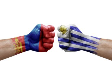 Two hands punch to each others on white background. Country flags painted fists, conflict crisis concept between mongolia and uruguay