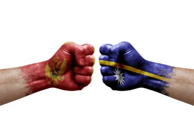 Two hands punch to each others on white background. Country flags painted fists, conflict crisis concept between montenegro and nauru