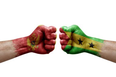 Two hands punch to each others on white background. Country flags painted fists, conflict crisis concept between montenegro and sao tome and principe