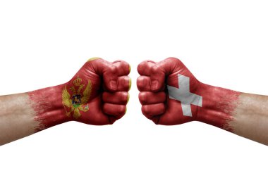 Two hands punch to each others on white background. Country flags painted fists, conflict crisis concept between montenegro and switzerland