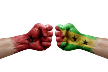 Two hands punch to each others on white background. Country flags painted fists, conflict crisis concept between morocco and sao tome and principe