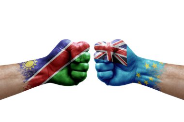 Two hands punch to each others on white background. Country flags painted fists, conflict crisis concept between namibia and tuvalu