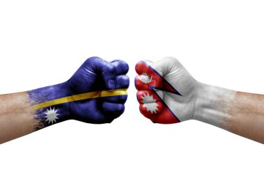 Two hands punch to each others on white background. Country flags painted fists, conflict crisis concept between nauru and nepal