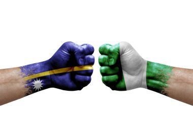 Two hands punch to each others on white background. Country flags painted fists, conflict crisis concept between nauru and nigeria