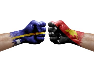 Two hands punch to each others on white background. Country flags painted fists, conflict crisis concept between nauru and papua new guinea