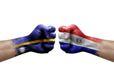 Two hands punch to each others on white background. Country flags painted fists, conflict crisis concept between nauru and paraguay