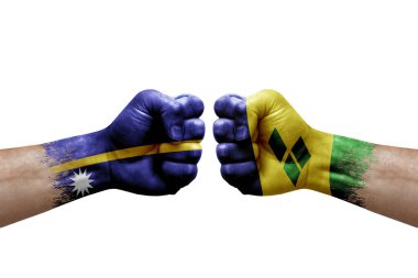Two hands punch to each others on white background. Country flags painted fists, conflict crisis concept between nauru and saint vincent and the grenadines