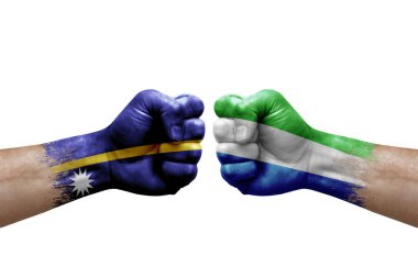Two hands punch to each others on white background. Country flags painted fists, conflict crisis concept between nauru and sierra leone