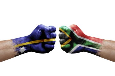 Two hands punch to each others on white background. Country flags painted fists, conflict crisis concept between nauru and south africa