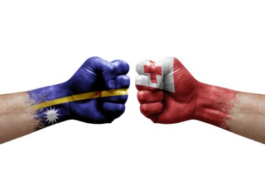 Two hands punch to each others on white background. Country flags painted fists, conflict crisis concept between nauru and tonga