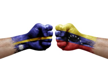 Two hands punch to each others on white background. Country flags painted fists, conflict crisis concept between nauru and venezuela
