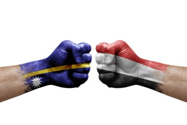 Two hands punch to each others on white background. Country flags painted fists, conflict crisis concept between nauru and yemen